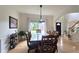 Elegant dining room with a large table, hardwood floors, and plenty of natural light at 1657 Millhouse Lndg, Marietta, GA 30066