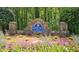 Stone entrance sign for Spencer's Mill community, surrounded by colorful landscaping and flowers at 1657 Millhouse Lndg, Marietta, GA 30066