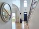 Inviting foyer with hardwood floors, staircase with wrought iron, and high ceilings at 1657 Millhouse Lndg, Marietta, GA 30066