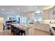 Beautiful kitchen with stainless appliances, white cabinets and marble countertops open to the dining and living area at 1657 Millhouse Lndg, Marietta, GA 30066