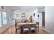 Bright kitchen with stainless appliances, marble countertops and center island, hardwood floors, and dining area at 1657 Millhouse Lndg, Marietta, GA 30066