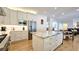 Open kitchen with granite countertops, stainless steel appliances, white subway tile backsplash, and white cabinetry at 1657 Millhouse Lndg, Marietta, GA 30066