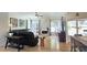Cozy living room with hardwood floors, fireplace, and open views to the backyard at 1657 Millhouse Lndg, Marietta, GA 30066