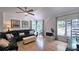 Bright living room with hardwood floors, a fireplace, and large windows overlooking the pool at 1657 Millhouse Lndg, Marietta, GA 30066
