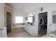 Bright main bathroom with tub, walk-in shower, double vanity, and closet access at 1657 Millhouse Lndg, Marietta, GA 30066