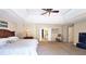 Spacious main bedroom features tray ceilings, a ceiling fan, and ensuite bath access at 1657 Millhouse Lndg, Marietta, GA 30066