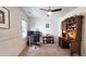 Office with desk, ceiling fan, natural light and wainscoting at 1657 Millhouse Lndg, Marietta, GA 30066