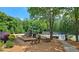 Community playground with climbing structures, benches, and picnic tables near the tennis court at 1657 Millhouse Lndg, Marietta, GA 30066