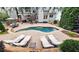 Stunning backyard features an in-ground pool, outdoor kitchen, hot tub, and spiral staircase access to upper balcony at 1657 Millhouse Lndg, Marietta, GA 30066