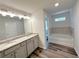 Bathroom featuring double sinks, granite countertops, and a separate tub at 19 Loth Wages (Lot 19) Rd, Dacula, GA 30019