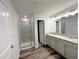 Bathroom with double sinks, granite countertops, and a glass shower at 19 Loth Wages (Lot 19) Rd, Dacula, GA 30019