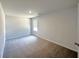 Bedroom with large windows that let in plenty of natural light and new carpet at 19 Loth Wages (Lot 19) Rd, Dacula, GA 30019