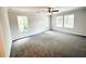 Spacious bedroom with large windows that let in plenty of natural light and new carpet at 19 Loth Wages (Lot 19) Rd, Dacula, GA 30019