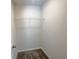 Walk-in closet offers carpet flooring and a wire shelf for optimal storage solutions at 19 Loth Wages (Lot 19) Rd, Dacula, GA 30019