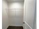 Walk-in closet featuring new carpet and a shelf at 19 Loth Wages (Lot 19) Rd, Dacula, GA 30019