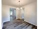 Charming dining room with elegant chandelier and wood floors at 19 Loth Wages (Lot 19) Rd, Dacula, GA 30019