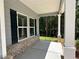 Cozy covered front porch featuring classic columns and a view of the landscaped yard at 19 Loth Wages (Lot 19) Rd, Dacula, GA 30019