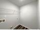 Laundry room featuring new flooring, hook ups and a shelf at 19 Loth Wages (Lot 19) Rd, Dacula, GA 30019