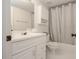 Bright bathroom with white vanity, tub, and shower combination at 2174 Basque Se Dr, Smyrna, GA 30080