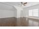 Bedroom featuring hardwood flooring, a ceiling fan, and a storage area at 2174 Basque Se Dr, Smyrna, GA 30080