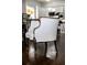 Elegant white chair with a decorative dark wooden frame, perfect for adding sophistication to any room at 2174 Basque Se Dr, Smyrna, GA 30080