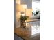 Close-up of a granite countertop featuring a stylish lamp and decorative green plant next to a bright window at 2174 Basque Se Dr, Smyrna, GA 30080
