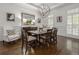 Elegant dining room showcasing hardwood floors, wainscoting and large window with shutter detail at 2174 Basque Se Dr, Smyrna, GA 30080