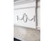Intricate detailing adorns the marble fireplace, enhancing this home's elegance at 2174 Basque Se Dr, Smyrna, GA 30080