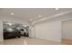 Garage with parking space for two vehicles and extra storage, including a refrigerator at 2174 Basque Se Dr, Smyrna, GA 30080