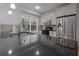 Modern kitchen featuring stainless steel appliances, granite countertops, and natural light at 2174 Basque Se Dr, Smyrna, GA 30080