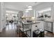 Open kitchen with a breakfast bar island, stainless steel appliances, and an open view to the living room at 2174 Basque Se Dr, Smyrna, GA 30080