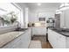Bright kitchen featuring stainless steel appliances, a central island, and white cabinetry at 2174 Basque Se Dr, Smyrna, GA 30080