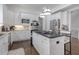 Bright kitchen featuring stainless steel appliances, a central island, and white cabinetry at 2174 Basque Se Dr, Smyrna, GA 30080