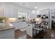 Modern kitchen with white cabinets, stainless steel appliances, island with seating, and granite countertops at 2174 Basque Se Dr, Smyrna, GA 30080