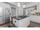 Well-equipped kitchen with stainless steel appliances, island cooktop, and white cabinetry at 2174 Basque Se Dr, Smyrna, GA 30080