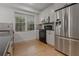 Modern kitchen with stainless steel appliances and hardwood floors at 2174 Basque Se Dr, Smyrna, GA 30080