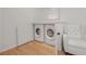 Modern laundry area with side by side washer and dryer at 2174 Basque Se Dr, Smyrna, GA 30080