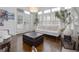 Bright living room with hardwood floors, white sofa, and access to outdoor area through French doors at 2174 Basque Se Dr, Smyrna, GA 30080