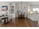 Bright living space with fireplace, built-in shelves, hardwood floors, and open concept to kitchen at 2174 Basque Se Dr, Smyrna, GA 30080