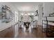 Bright living room with hardwood floors, fireplace, bar area, and access to outdoor area at 2174 Basque Se Dr, Smyrna, GA 30080
