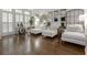 Sitting room featuring hardwood floors, multiple sofas, and bright natural light at 2174 Basque Se Dr, Smyrna, GA 30080