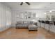 Open-concept living space with sofa, breakfast bar, and hardwood floors at 2174 Basque Se Dr, Smyrna, GA 30080