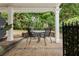 Charming patio with brick pavers and outdoor seating area surrounded by a lush, green landscape at 2174 Basque Se Dr, Smyrna, GA 30080
