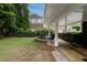 Inviting outdoor patio with seating area and a landscaped yard perfect for entertaining and relaxation at 2174 Basque Se Dr, Smyrna, GA 30080