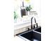 Stylish black kitchen sink with modern bronze faucet and fixtures at 2174 Basque Se Dr, Smyrna, GA 30080