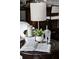 Sitting area with lamp, houseplant, and other decor elements on round side table at 2174 Basque Se Dr, Smyrna, GA 30080