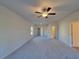 Large bedroom with a ceiling fan and three entryways providing ease of access at 28 Loth Wages (Lot 28) Rd, Dacula, GA 30019