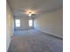 Bright, open bedroom featuring neutral carpeting and a modern ceiling fan at 28 Loth Wages (Lot 28) Rd, Dacula, GA 30019
