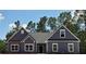 Beautiful new single-story home with modern design, stone accents, and ample natural light at 28 Loth Wages (Lot 28) Rd, Dacula, GA 30019