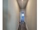Hallway with wood-look flooring leading to rooms with natural light at 28 Loth Wages (Lot 28) Rd, Dacula, GA 30019